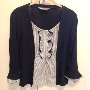 Black top with ruffle trimming